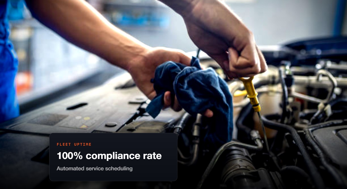 Technician servicing a truck with OGRE diagnostics — 100% compliance rate, automated service scheduling